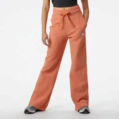 New Balance Spodnie damskie New Balance WP23502CDA – pomarańczowe