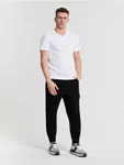 Spodnie jeansowe o kroju jogger uszyte z bawełny z domieszką elastyczych włókien. - czarny