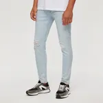 Jasnoniebieskie jeansy slim fit z dziurami - Niebieski