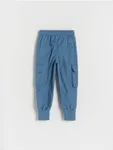 Spodnie typu jogger, wykonane z gładkiej tkaniny z bawełną. - niebieski