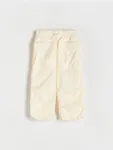 Spodnie o regularnym fasonie, wykonane z tkaniny. - żółty