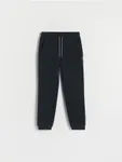 Dresowe spodnie typu jogger, wykonane z miękkiej dzianiny z bawełną. - czarny