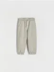 Spodnie typu jogger, wykonane z bawełnianej dzianiny z efektem sprania. - jasnozielony