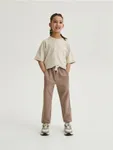 Spodnie typy jogger, wykonane z bawełnianej dzianiny dresowej. - brązowy