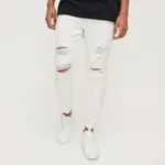 Białe jeansy slim fit z przetarciami - Biały