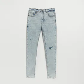 Jasne jeansy skinny fit z przetarciami - Niebieski