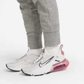 Dopasowane spodnie z dzianiny dresowej dla dużych dzieci (dziewcząt) (szersze rozmiary) Nike Sportswear Club - Szary