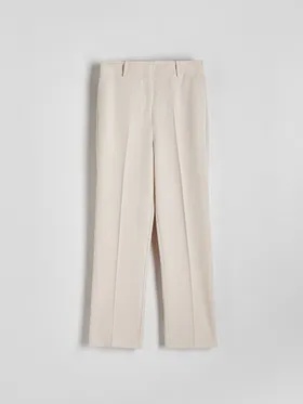 Spodnie typu cygaretki z prostą nogawką, wykonane z tkaniny z wiskozą. - beżowy
