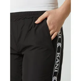 KARL KANI Spodnie sportowe z paskami z logo