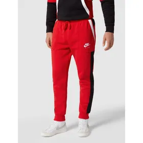Nike Spodnie dresowe z paskami w kontrastowym kolorze