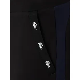 Lacoste Spodnie dresowe z paskami w kontrastowym kolorze