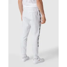 Nike Spodnie dresowe z paskami w kontrastowym kolorze