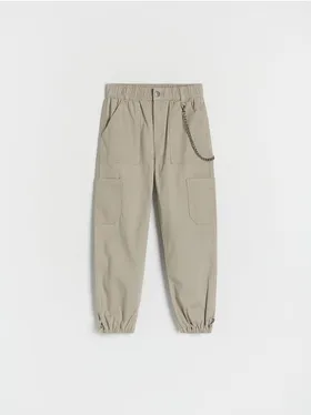 Spodnie typu jogger, wykonane z bawełnianej tkaniny. - zielony