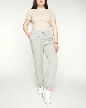 Damskie szare spodnie materiałowe typu joggery PLUS SIZE- Odzież - Szary || Jasnoszary