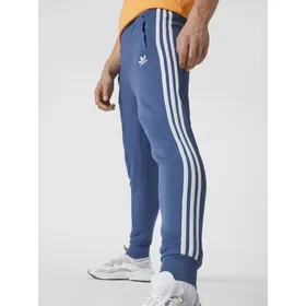 adidas Originals Spodnie dresowe z paskami z logo
