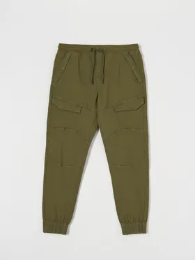 Spodnie jeansowe o kroju jogger uszyte z bawełny z domieszką elastyczych włókien. - zielony