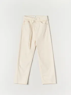 Spodnie jeansowe o luźnym kroju wykonane w 100% z bawełny. - kremowy