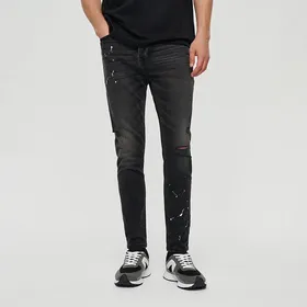 Czarne jeansy skinny fit paint splash vintage - Czarny