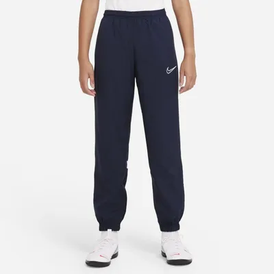 Nike Dresowe spodnie piłkarskie z tkaniny dla dużych dzieci Nike Dri-FIT Academy - Niebieski