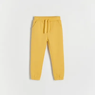 Reserved Dresowe spodnie jogger - Żółty