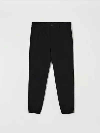 Sinsay Bawełniane spodnie o kroju jogger z domieszką elastycznych włókien. - czarny