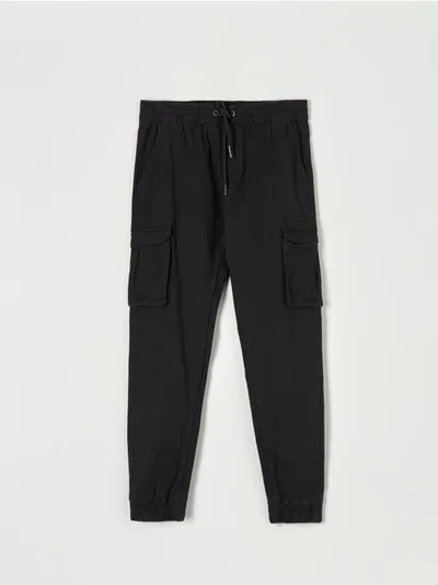 Sinsay Spodnie o kroku jogger z kieszeniami cargo, uszyte z bawełny z domieszką elastycznych włókien. - szary