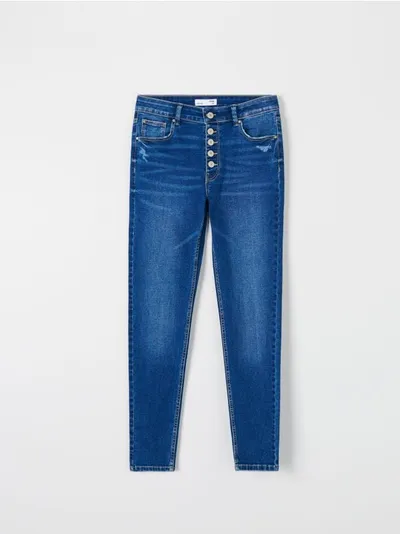 Sinsay Spodnie jeansowe skinny uszyte z bawełny z domieszką elastycznych włókien. - granatowy