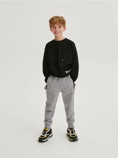 Reserved Spodnie typu jogger, wykonane z bawełnianej dzianiny typu pika. - ciemnoszary