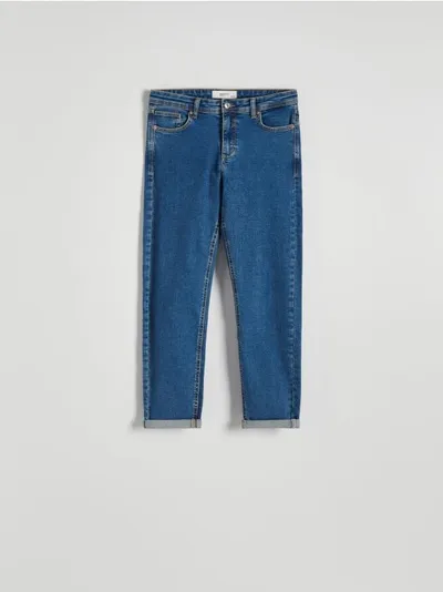 Reserved Jeansy o lekko dopasowanym fasonie, uszyte z bawełny z domieszką elastycznych włókien. - niebieski