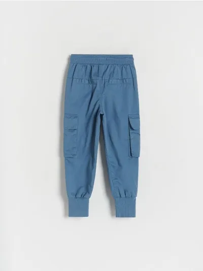 Reserved Spodnie typu jogger, wykonane z gładkiej tkaniny z bawełną. - niebieski