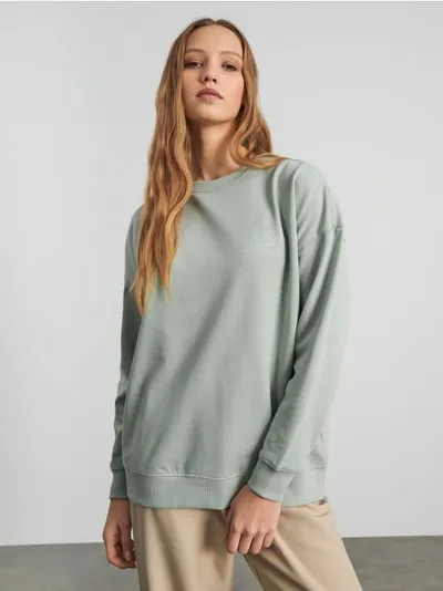 Sinsay Wygodna bluza o luźnym kroju uszyta z bawełny z dodatkiem szybkoschnącego materiału. - zielony