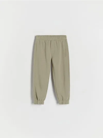 Reserved Dresowe spodnie typu jogger, wykonane z gładkiej, bawełnianej dzianiny. - oliwkowy