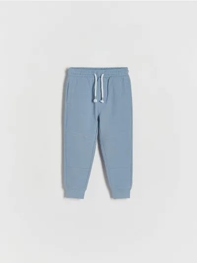 Reserved Spodnie o swobodnym fasonie, wykonane z bawełnianej dzianiny. - niebieski