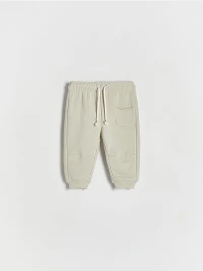Reserved Spodnie o swobodnym fasonie, wykonane z przyjemnej w dotyku, bawełnianej dzianiny. - jasnozielony