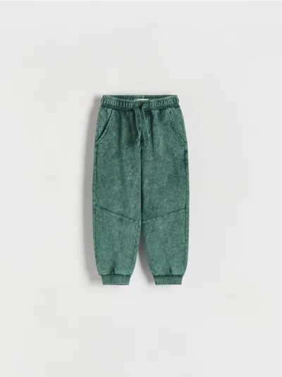 Reserved Dresowe spodnie typu jogger, wykonane z przyjemnej w dotyku dzianiny z bawełną. - ciemny turkus