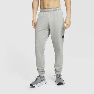 Nike Męskie spodnie treningowe o zwężanym kroju Nike Dri-FIT - Szary