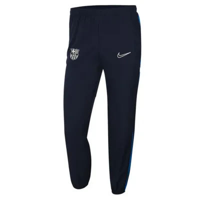 Nike Męskie spodnie piłkarskie z tkaniny Nike Dri-FIT FC Barcelona Academy - Niebieski