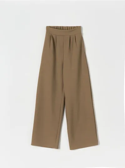 Sinsay Spodnie z szerokimi nogawkami, uszyte z szybkoschnącego materiału z dodatkiem elastycznych włókien. - brązowy