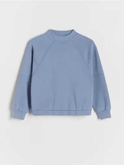 Reserved Bluza o luźnym kroju, wykonana z ciepłej dzianiny z bawełną. - jasnoniebieski
