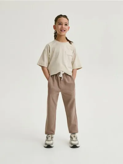 Reserved Spodnie typy jogger, wykonane z bawełnianej dzianiny dresowej. - brązowy
