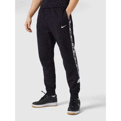 Nike Nike Spodnie dresowe z detalami z logo