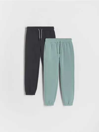 Reserved Dresowe spodnie typu jogger, wykonane z przyjemnej w dotyku, bawełnianej dzianiny. - turkusowy
