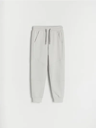 Reserved Spodnie typu jogger, wykonane z dresowej, bawełnianej dzianiny. - jasnoszary