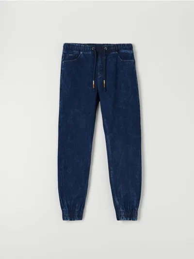 Sinsay Spodnie jeansowe o kroju jogger, wykonane z tkaniny z dodatkiem elastycznych włókien. - niebieski