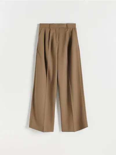 Reserved Spodnie o swobodnym fasonie, wykonane z gładkiej tkaniny z dodatkiem wiskozy. - brązowy