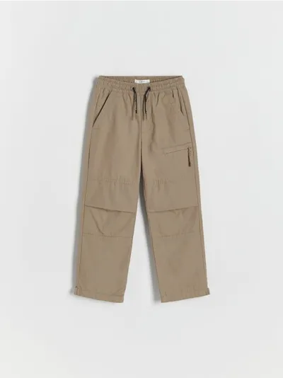 Reserved Spodnie typu jogger, wykonane z bawełnianej tkaniny z ociepleniem. - musztardowy
