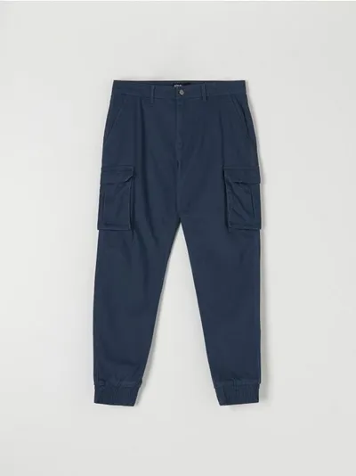 Sinsay Spodnie jogger z kieszeniami cargo, uszyty z bawełny z dodatkiem elastycznych włókien. - niebieski