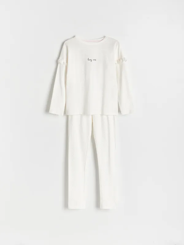 Piżama składająca się z koszulki i spodni, wykonana z dzianiny z bawełny. - złamana biel