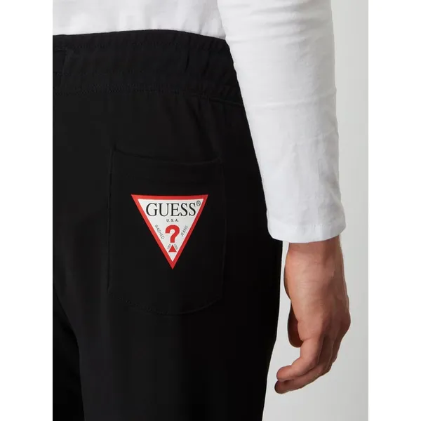 Guess Spodnie dresowe o kroju slim fit z kieszeniami zapinanymi na zamek błyskawiczny