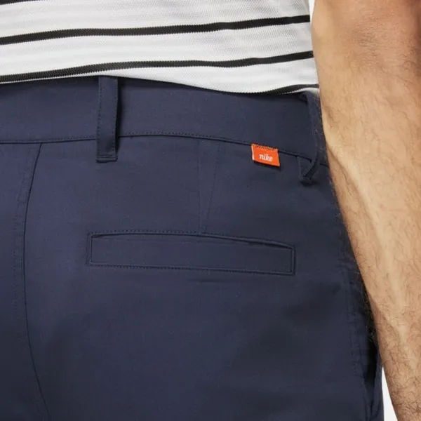 Męskie spodnie chino o dopasowanym kroju do golfa Nike Dri-FIT UV - Niebieski